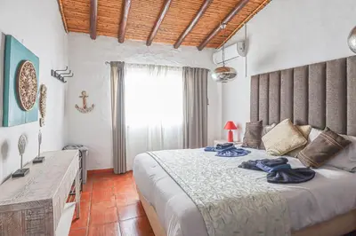 a bedroom with a large bed and a window at 2 Vale de Ursa - Swimming Pool - WIFI - BY BEDZY in Guia