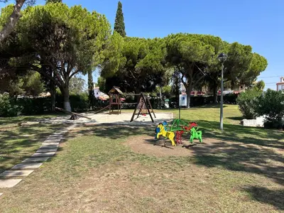 a park with a playground and a swing set at Açoteias Secrets in Albufeira