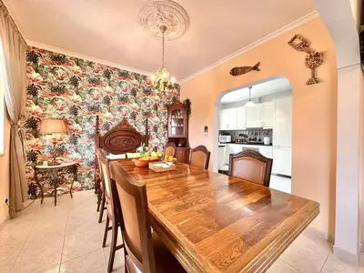 a kitchen and dining room with a wooden table at Casa Alfarroba - with heated indoor pool in Algoz