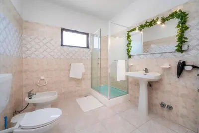 a bathroom with a toilet and a sink and a shower at Villa 4 Quartos, Piscina, AC, Jardim, Prestige For Home in Loulé