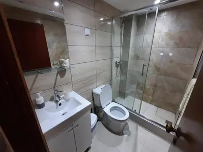 a bathroom with a toilet and a shower and a sink at Blife Benya private apartment in Faro