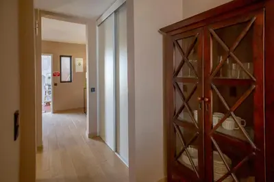a room with a wine cabinet and a hallway at Mary's Ocean in Albufeira