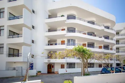 an apartment building with balconies on it at Mary's Ocean in Albufeira