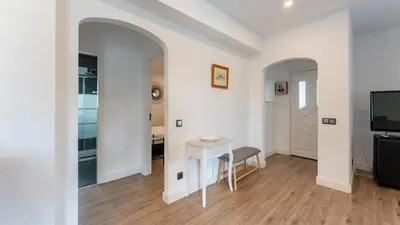 a living room with a table and a tv at Cozy 2BR near Oura Beach by LovelyStay in Albufeira