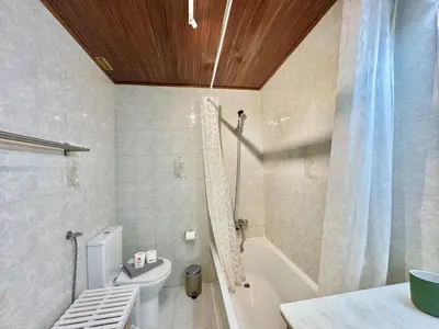 a bathroom with a shower and a toilet and a sink at Vilamoura Golf Apartment 2 With Pool by Homing in Vilamoura
