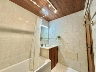 a bathroom with a tub and a sink and a shower at Vilamoura Golf Apartment 2 With Pool by Homing in Vilamoura