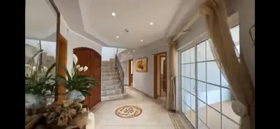 a hallway of a home with a staircase and a staircase at The Beverly Vilamoura in Quarteira