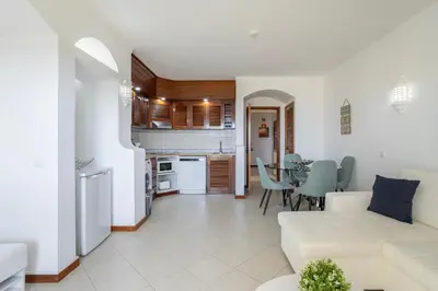 a living room with a white couch and a table at Dream place- Bela Vista in Albufeira