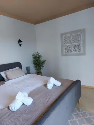 a bedroom with a bed with towels on it at Quinta da Calma with pool and BBQ in Boliqueime