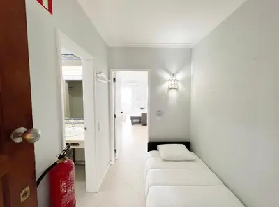 a room with two white seats in a bathroom at Sea View Apartment Albufeira in Albufeira