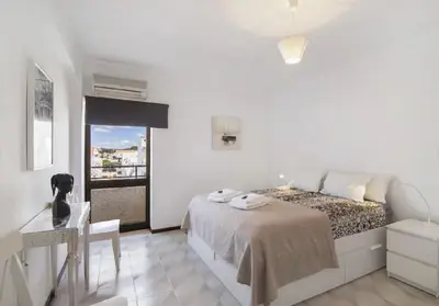 a living room with a couch and a table at Algarve Paraíso Casa Solimô in Bicas