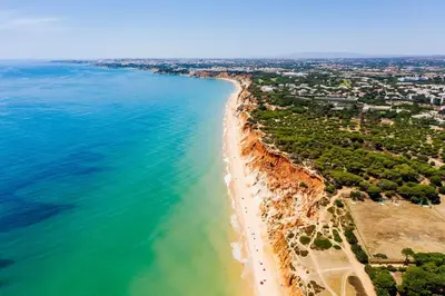 an aerial view of a beach and the ocean at Falesia beach Pool quiet side by Enjoyyourstay in Albufeira