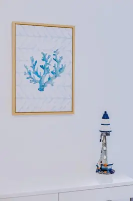 a framed picture of a tree and a lighthouse at Falesia beach Pool quiet side by Enjoyyourstay in Albufeira