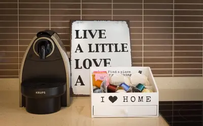 a black iron sitting next to a box of eggs at D_Loft Downtown in Albufeira