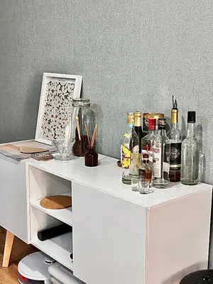 a white desk with bottles and glasses on it at StayBaixa Faro in Faro