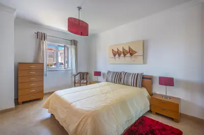 a bedroom with a large bed and a dresser at Villa Ancora - Nex to the Beach - Parking - Swimming Pool - BY BEDZY in Albufeira