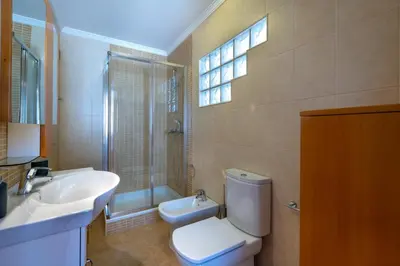 a bathroom with a toilet and a sink and a shower at Villa Ancora - Nex to the Beach - Parking - Swimming Pool - BY BEDZY in Albufeira