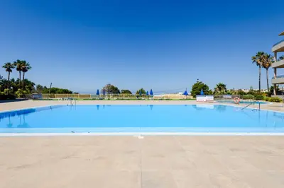 a large swimming pool next to a building at Albufeira Comfort Luxury Quinta Barracuda in Albufeira