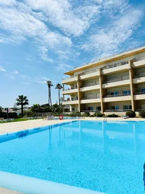 a large swimming pool in front of a hotel at Albufeira Comfort Luxury Quinta Barracuda in Albufeira