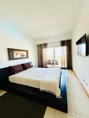 a bedroom with a large bed and a large window at Albufeira Comfort Luxury Quinta Barracuda in Albufeira