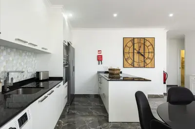 a kitchen with a sink and a counter top at Espadarte - Sea view by HD in Quarteira