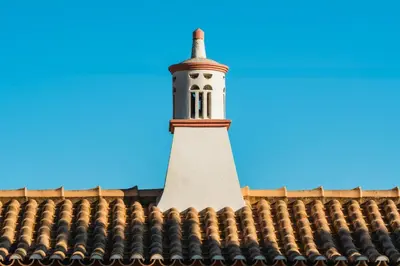 a lighthouse on the roof of a building at Villa Las Rosas in Albufeira