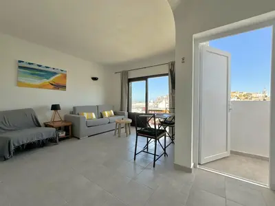a living room with a couch and a table at Villa Terraza - Center Hideaway in Albufeira