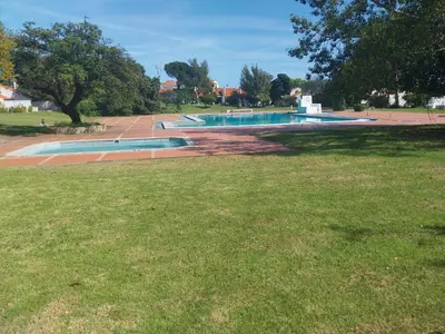 a group of swimming pools in a park at Albufeira Oura Apartment in Albufeira