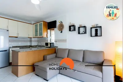 a swimming pool in front of a building at #275 Only Families - A Flor by Home Holidays in Albufeira