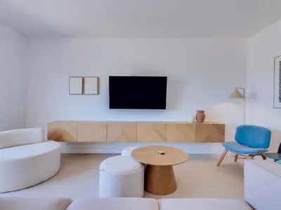 a living room with a couch and a tv at Art and Sea 2 bedroom apartment in Quarteira