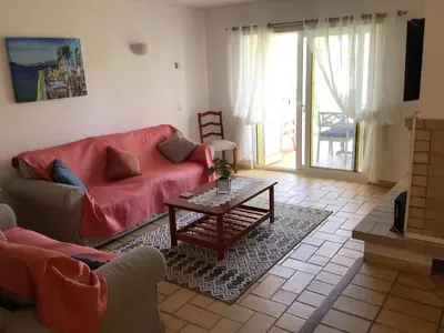 a living room with a couch and a table at 2 Bedroom Townhouse, Vale de Parra in Guia