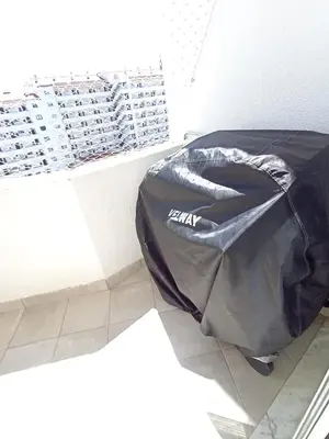 a black bag sitting on the floor in a room at Panoramic View in Albufeira