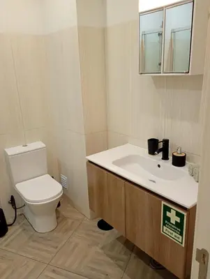 a bathroom with a toilet and a sink at Panoramic View in Albufeira