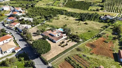an aerial view of a house with a train at Casa da Colina in Albufeira