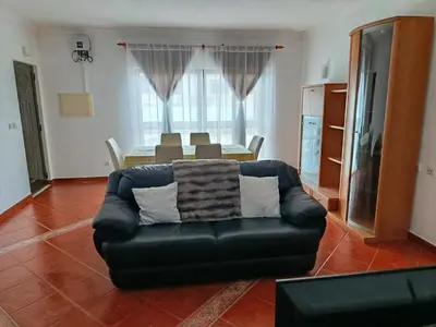 a living room with a couch and a table at Villa Vacations Marie in Albufeira