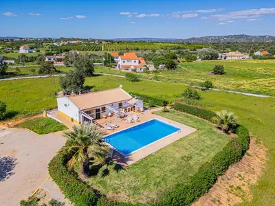 an aerial view of a house with a swimming pool at Quinta da Bisa - Casa das Pedrinhas in Algoz