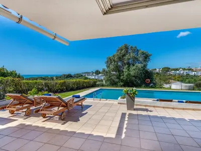 a house with a swimming pool and a patio at Villa Rosa by Interhome in Sesmarias