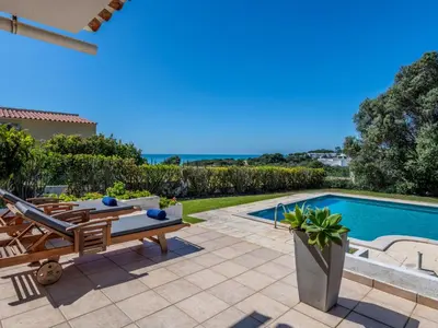 a villa with a swimming pool and a patio at Villa Rosa by Interhome in Sesmarias