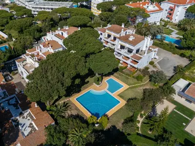 an aerial view of a mansion with a swimming pool at Apartment Brisa dos Pinheiros by Interhome in Vilamoura