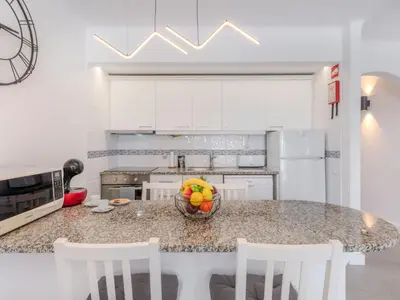 a kitchen with a bowl of fruit on a counter at Apartment Brisa dos Pinheiros by Interhome in Vilamoura