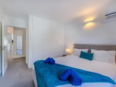 a balcony with a table and chairs and a swimming pool at Apartment Brisa dos Pinheiros by Interhome in Vilamoura