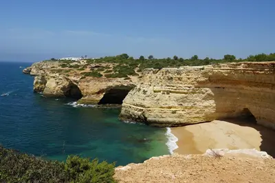 a view of a rocky shoreline with the ocean at Modern Apartment in Albufeira in Albufeira