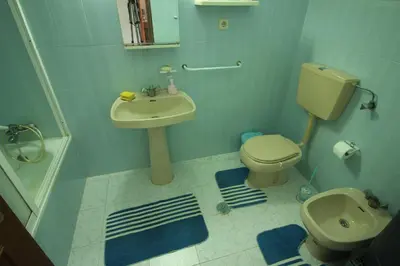 a bathroom with a toilet and a sink at Modern Apartment in Albufeira in Albufeira