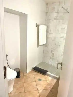 a bathroom with a shower and a toilet at Toca das Manas in Roja- Pé