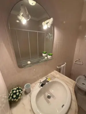 a bathroom with a sink and a mirror at Jardim Santa Eulália By Albufeira Rental in Albufeira