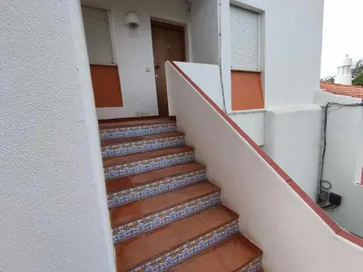 a stairway leading to the door of a building at Albufeira INN - Vale Navio T2 in Albufeira
