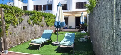 a bedroom with a bed with two pillows on it at Casa do Baco - Private Pool in Quarteira
