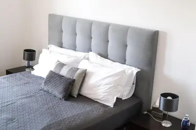 a bedroom with a large bed with white pillows at Silver Globe in Albufeira