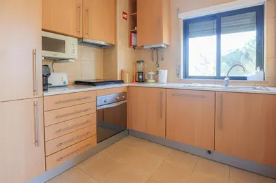 a living room with a counter with plants on it at Apart Salgados Village - Near to the Beach - BY BEDZY in Guia