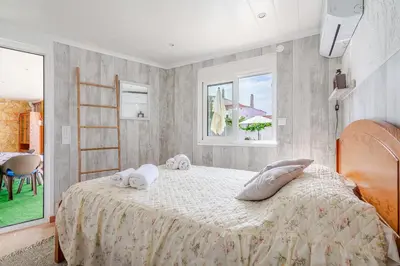 a bedroom with a bed with towels on it at Maison Du Soleil by Seareen in Albufeira